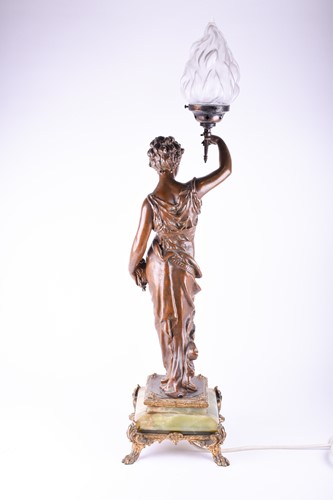 Lot 299 - A large patinated spelter table lamp, modelled...
