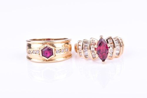 Lot 724 - A yellow metal, CZ and red stone ring the wide...