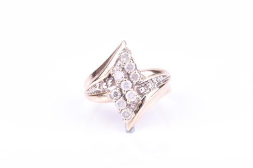 Lot 658 - A yellow metal and diamond ring the crossover...