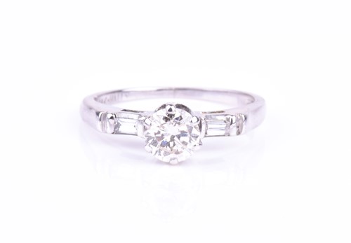 Lot 680 - A 14k white gold and diamond ring set with a...