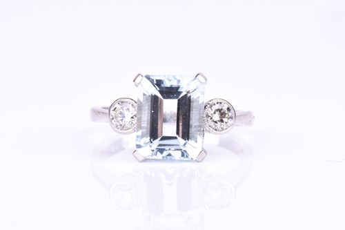 Lot 740 - A platinum, diamond, and aquamarine ring set...