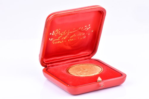 Lot 417 - An Iranian 22ct gold proof medal commemorating...