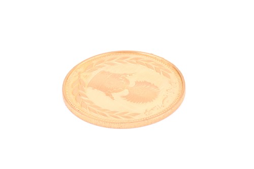 Lot 422 - An Iranian 22ct gold commemorative proof medal,...