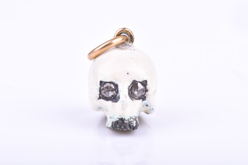 Lot 500 - An unusual silver and enamel skull pendant,...