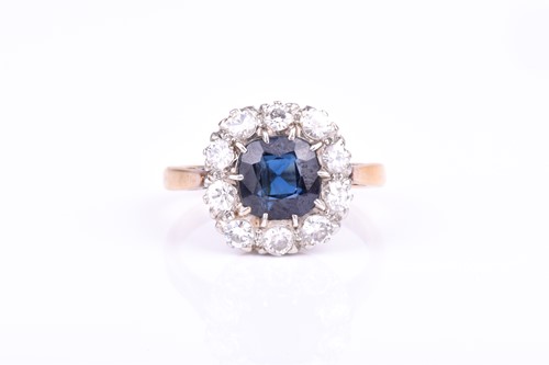 Lot 568 - An 18ct yellow gold and sapphire cluster ring...