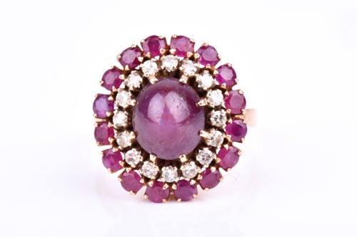 Lot 422 - An 18ct yellow gold, diamond, and ruby oval...