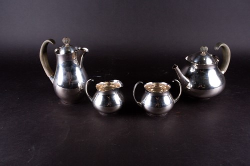 Lot 509 - A mid-20th century four-piece silver tea set,...