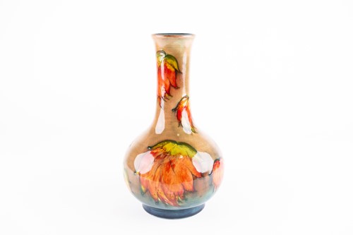 Lot 44 - A William Moorcroft flambé leaf pattern vase,...