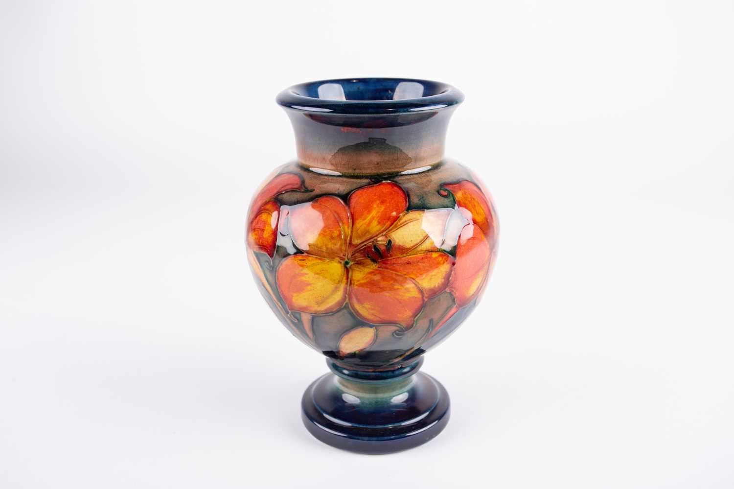 Lot 31 - A William Moorcroft flambe African Lily...