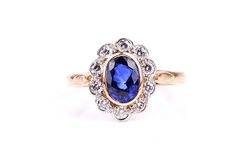 Lot 719 - An 18ct yellow gold, diamond, and sapphire...