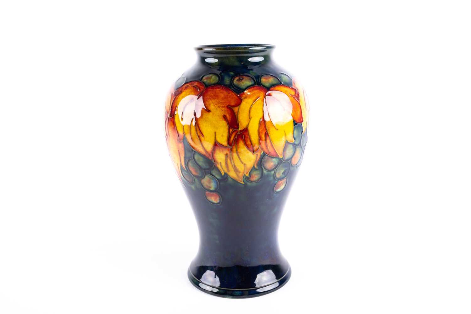 Lot 41 - A William Moorcroft flambé 'Leaf & Berry' vase,...