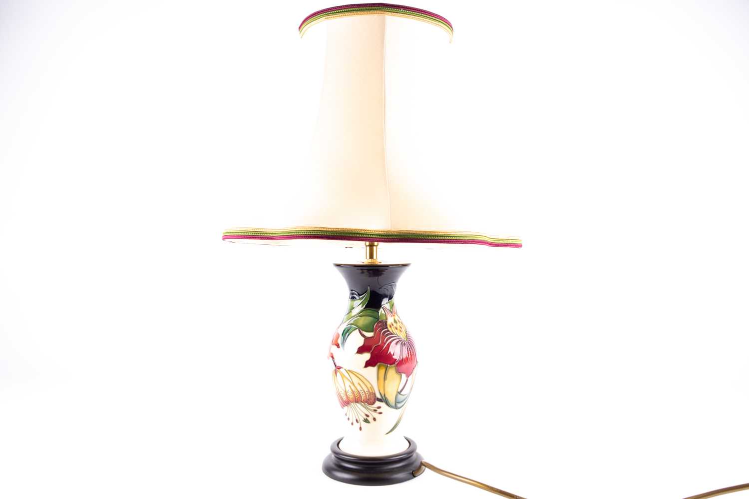 Lot 27 - A Moorcroft 'Anna Lily' pattern table lamp,...