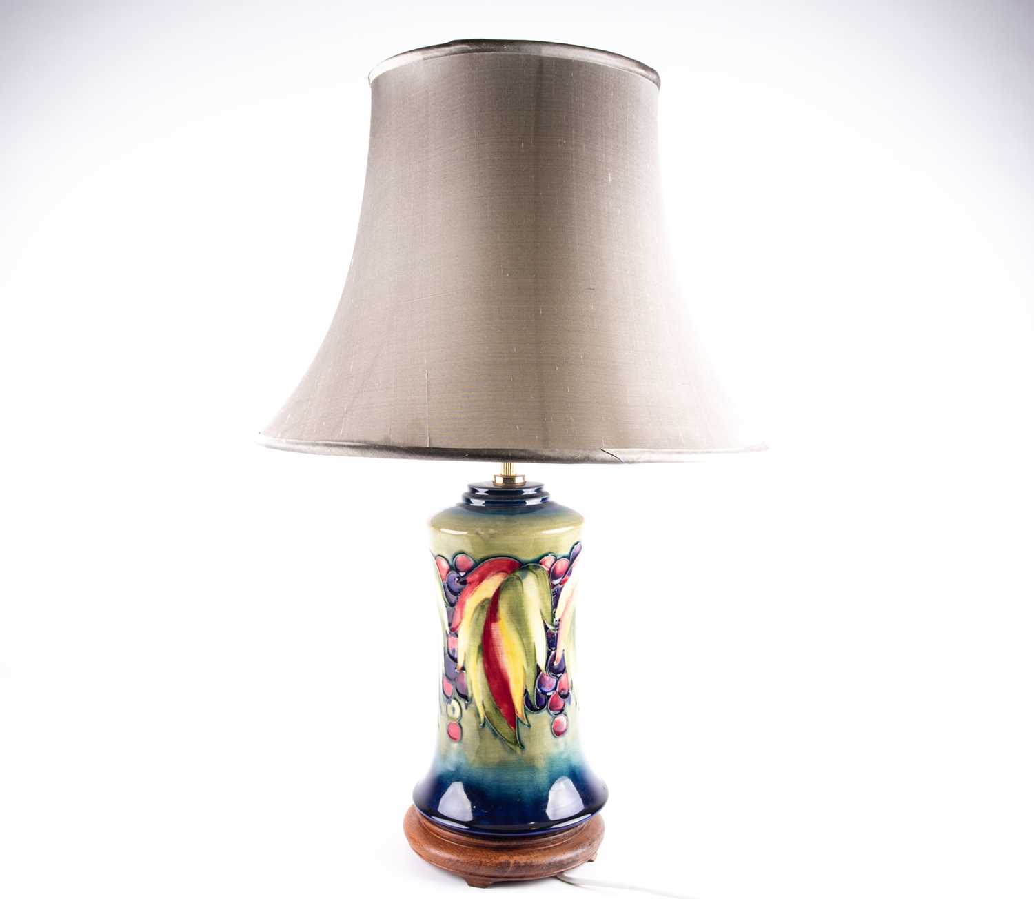 Lot 287 - A Moorcroft 'Leaf & Berry' pattern table lamp,...