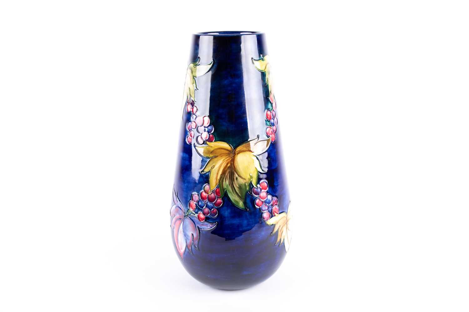 Lot 279 - A Walter Moorcroft 'Leaf & Berry' pattern vase,...