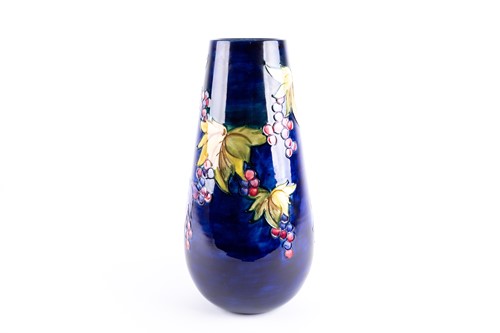 Lot 279 - A Walter Moorcroft 'Leaf & Berry' pattern vase,...