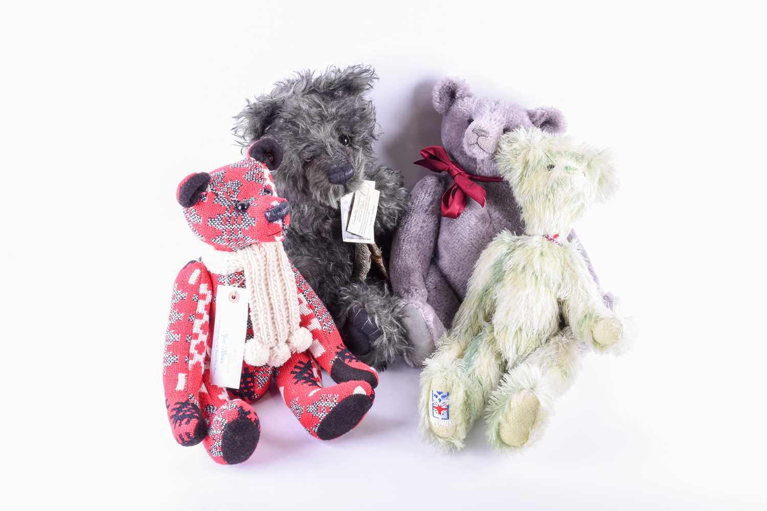 Lot 79 - A group of four jointed teddy bears,...