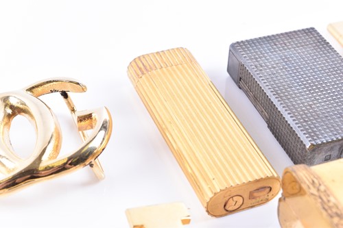 Lot 348 - A Cartier lighter, gilt metal, of ribbed...