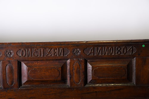 Lot 121 - An early 19th oak church pew, with cushioned...