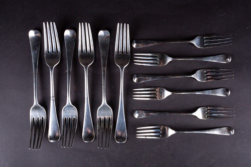 Lot 494 - A set of six George III silver table forks,...