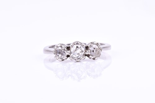 Lot 591 - A platinum and diamond three stone ring, set...