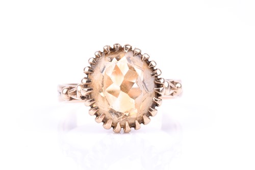 Lot 813 - A 9ct yellow gold and citrine ring, set with a...