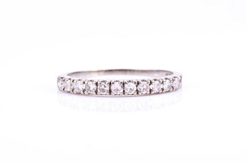 Lot 674 - An 18ct white gold and diamond half eternity...