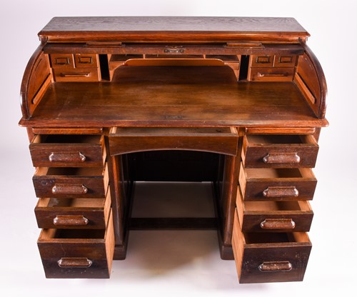 Lot 124 - A 1920s oak roll top clerk's desk, by George...