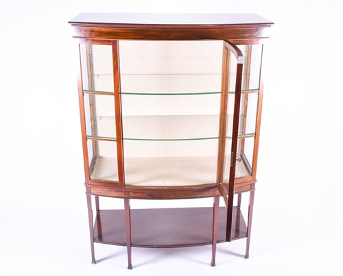 Lot 141 - A late 19th century mahognay bow-front display...