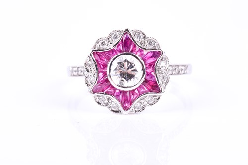 Lot 598 - An 18ct white gold, diamond, and ruby ring, in...