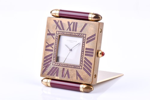Lot 395 - A Cartier travel clock, of square form with...