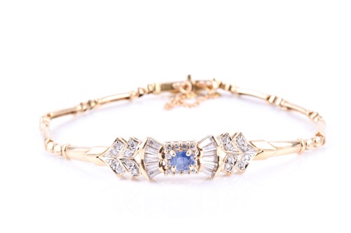 Lot 641 - An 18ct yellow gold, sapphire, and clear cubic...