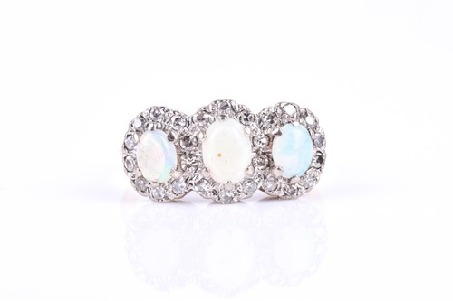 Lot 789 - An 18ct yellow gold, diamond, and opal ring,...