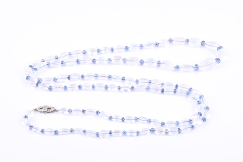 Lot 634 - An opera length moonstone and sapphire...