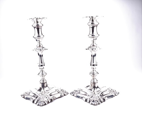 Lot 525 - A pair of Edwardian silver candlesticks,...