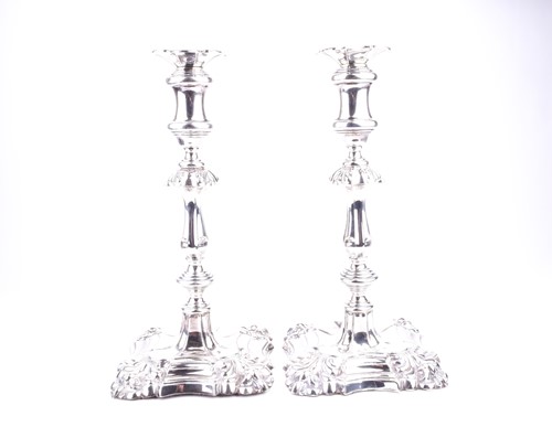 Lot 525 - A pair of Edwardian silver candlesticks,...