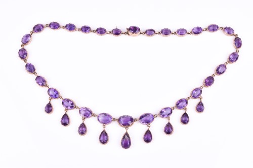 Lot 755 - A Victorian yellow gold and amethyst Riviere...