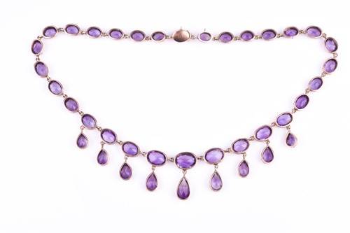 Lot 755 - A Victorian yellow gold and amethyst Riviere...