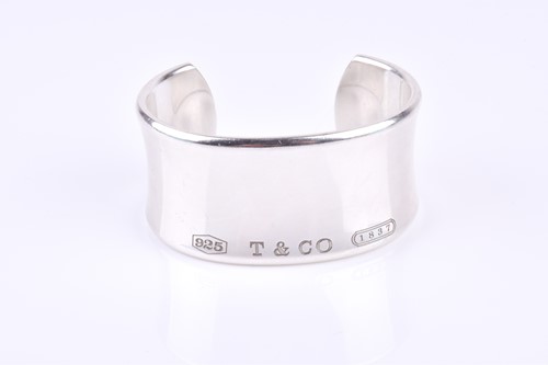 Lot 592 - Tiffany & Co. A silver bangle, marked '925 T &...