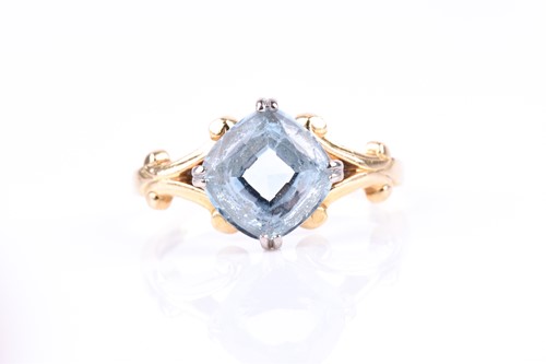 Lot 773 - An 18ct yellow gold and aquamarine ring, set...