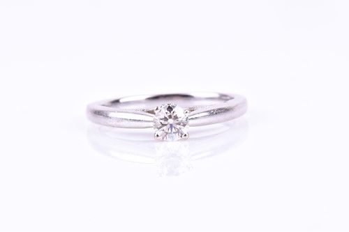 Lot 677 - A 14ct white gold and diamond solitaire ring,...