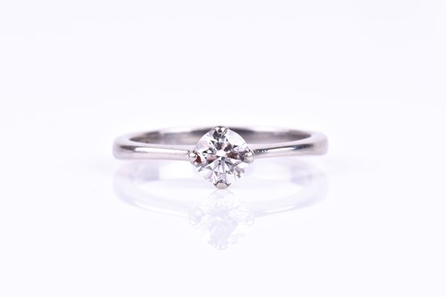 Lot 589 - A platinum and diamond engagement ring, set...