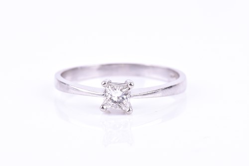 Lot 700 - A platinum and diamond ring, set with a...