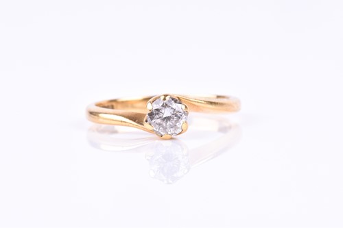 Lot 664 - An 18ct yellow gold and solitaire diamond ring,...