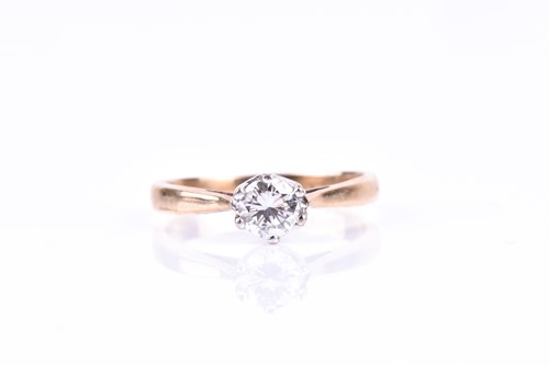 Lot 562 - An 18ct yellow gold and solitaire diamond ring,...