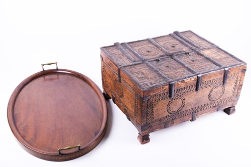 Lot 143 - An Indian dowry chest, with chip carved...