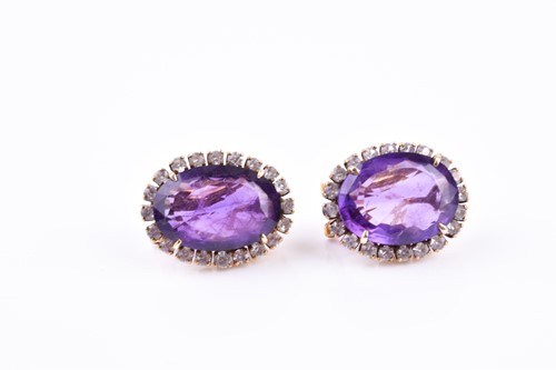 Lot 750 - A pair of yellow metal, amethyst, and white...