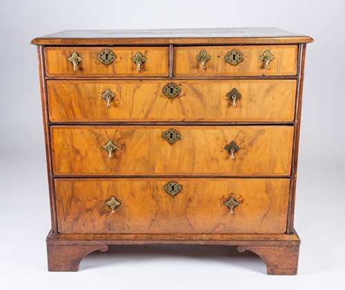 Lot 157 - An 18th century figured walnut chest of...