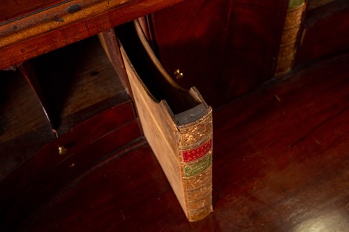 Lot 140 - A George III mahogany secretaire bookcase, the...