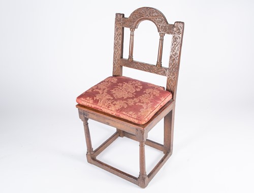 Lot 156 - An 18th century oak single chair, with carved...