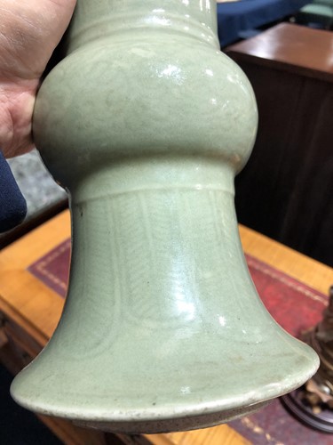 Lot 196 - A Chinese celadon phoenix tail vase, Qing, the...